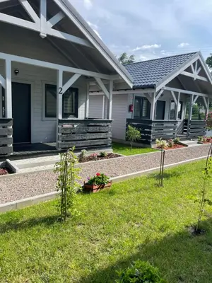 a house with a garden in front of it at Brzozowy Zakątek Zator in Zator