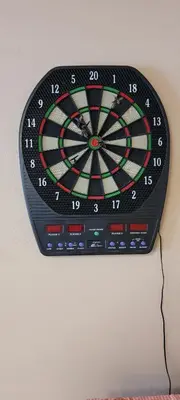 a dart board is hanging on a wall at Gryglówka Noclegi in Zembrzyce