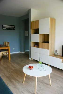 a living room with a table and a dining room at Taboo by Housine in Zator