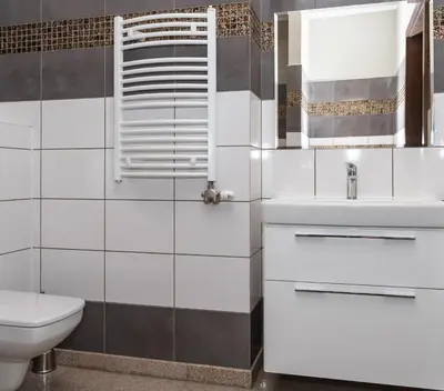 a bathroom with a toilet and a sink at APARTAMENT Piłsudskiego13 Chrzanów in Chrzanów