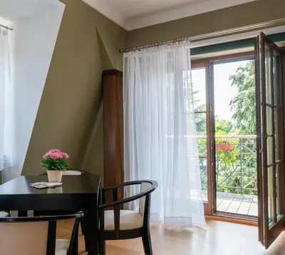 a dining room with a table and a window at APARTAMENT Piłsudskiego13 Chrzanów in Chrzanów