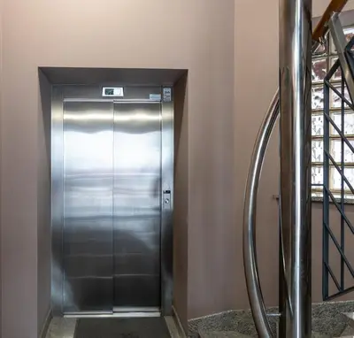 an elevator in a building with a metal door at APARTAMENT Piłsudskiego13 Chrzanów in Chrzanów