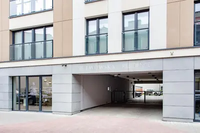 an entrance to a building with a parking garage at Spacious and modern Apartment Lwowska, close to Kazimierz in Kraków