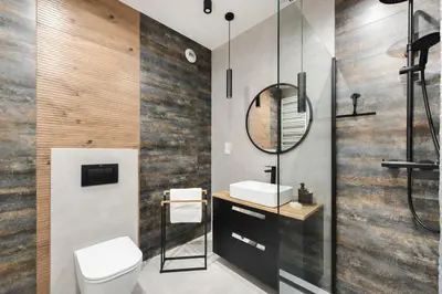 a bathroom with a toilet and a sink and a mirror at Spacious and modern Apartment Lwowska, close to Kazimierz in Kraków