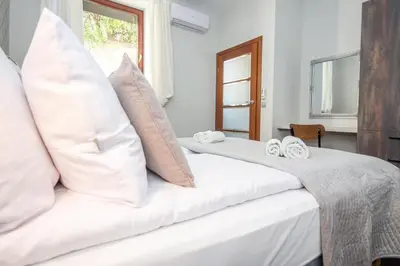 a bedroom with two beds with white pillows at InPoint 2-bedrooms Apartment with private garden and free parking in Kraków