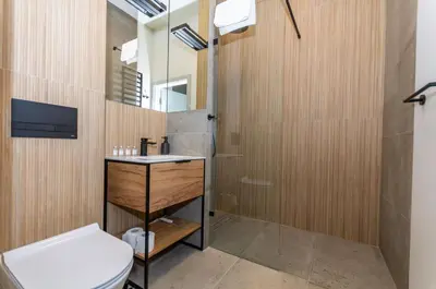 a bathroom with a toilet and a sink and a shower at InPoint Sunny Studio next to Wawel Castle - Kossaka 5 Self Check-in in Kraków