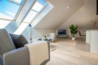 an attic living room with skylights at InPoint Sunny Studio next to Wawel Castle - Kossaka 5 Self Check-in in Kraków
