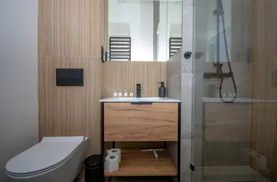 a bathroom with a toilet and a sink and a shower at InPoint Sunny Studio next to Wawel Castle - Kossaka 5 Self Check-in in Kraków