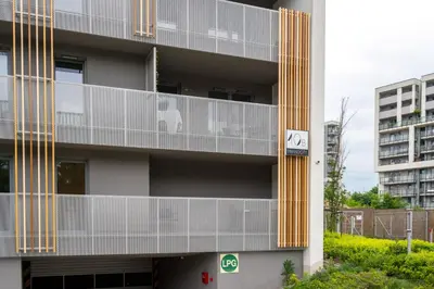 an apartment building with a dog on a balcony at Exclusive Royal Apartment in Kraków