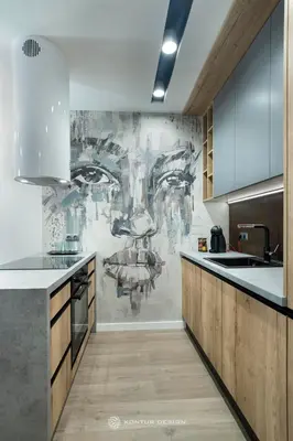 a kitchen with a painting on the wall at City of the Kings - Podskale 18 in Kraków