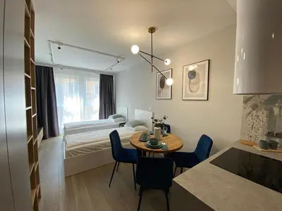 a small room with a table and a bed at City of the Kings - Podskale 18 in Kraków