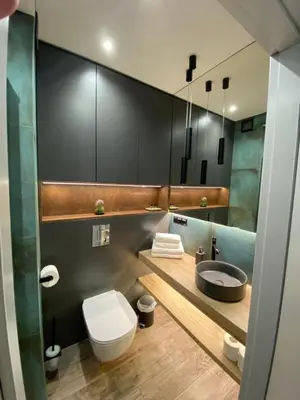 a bathroom with a toilet and a sink at City of the Kings - Podskale 18 in Kraków