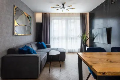 a living room with a couch and a table at City of the Kings - Podskale 18 in Kraków