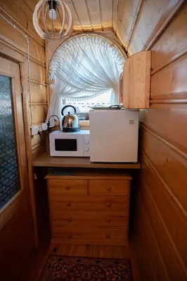 a room with a table and chairs in a cabin at u Winicjusza in Nowy Targ