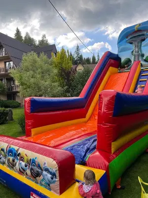 a child is playing on a inflatable bounce house at u Winicjusza in Nowy Targ