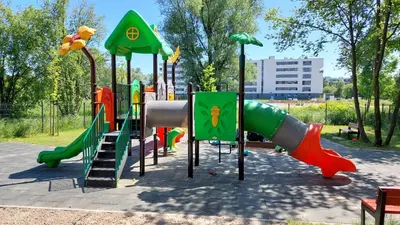 a playground in a park with a slide at Apartament przy Łąkach - Zakodomki (Kraków) in Kraków