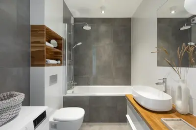 a bathroom with a sink and a toilet and a tub at Unique & Modern Apartment Zabłocie in Kraków