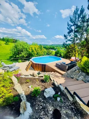 an image of a swimming pool in a yard at Villa Marlena - basen, balia, grill, billard, ogród i relaks in Spytkowice