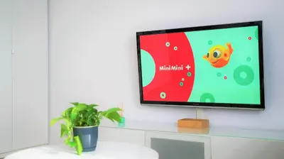 a room with a tv on the wall next to a window at Apartament ENJOY Zator - z widokiem na Energylandie in Zator