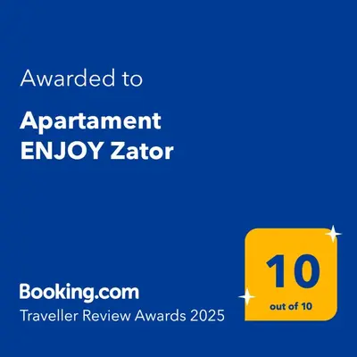 a living room with a couch and a tv at Apartament ENJOY Zator - z widokiem na Energylandie in Zator