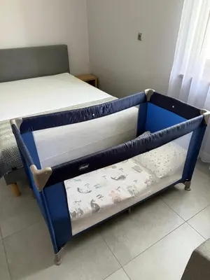 a blue bunk bed with two trays on it at Energylandia Zator noclegi apartament pokoje do wynajęcia in Polanka Wielka