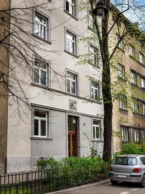 a building with a car parked in front of it at Tyzenhauz Apartments Wawel in Kraków