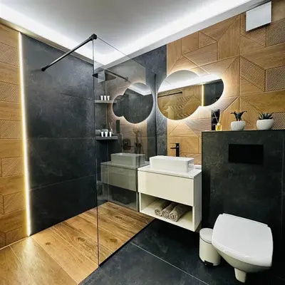 a bathroom with a white toilet and a sink at Domki pod Luboniem in Rabka