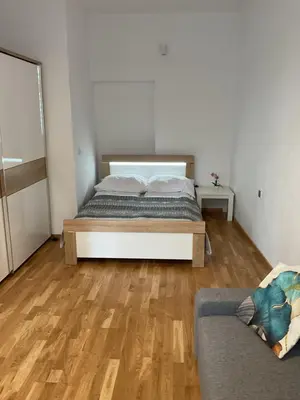 a bedroom with a bed and a couch in it at Apartment na Zamkowej in Kraków