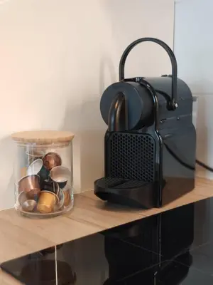 a container of food sitting on a wooden shelf at Nowoczesny apartament dla par in Kraków