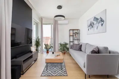 a living room with a couch and a coffee table at Modern & Spacious Apartment with Air Conditioning & Parking by Renters Prestige in Kraków