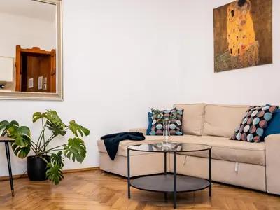 a living room with a couch and a table at Koletek 7 Apartment near the Wawel Castle in Kraków