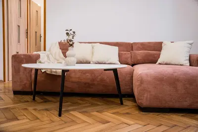 a living room with a couch and a table at Koletek 7 Apartment near the Wawel Castle in Kraków