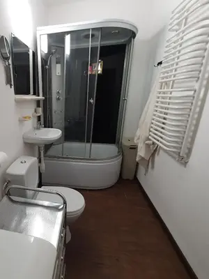 a bathroom with a toilet and a sink and a shower at BDSM Elysium Playsuite in Kraków