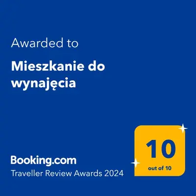 a yellow sign with the number on it at Mieszkanie do wynajęcia in Stróża