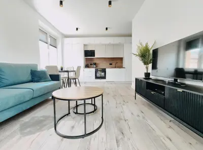 a living room with a couch and a table at Spasowskiego 2 by Homeprime in Kraków