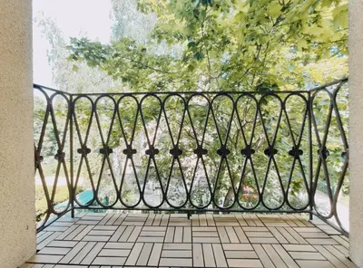 a metal gate on a balcony with a view at Spasowskiego 2 by Homeprime in Kraków