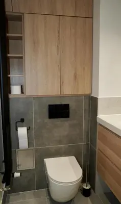 a bathroom with a toilet and a sink at Castle Apartments - Queen in Oświęcim