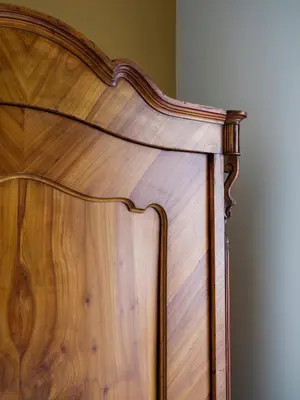 a close up of a wooden headboard of a bed at Bed & Beige Apartment / Kochanowskiego St in Kraków