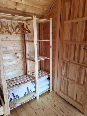a wooden sauna with two bunk beds in a cabin at Domek w drapie in Lubomierz