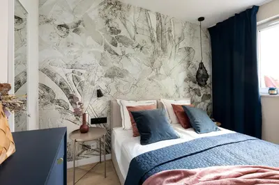 a bedroom with a bed and a wall mural at No 7 Terrace in Kraków