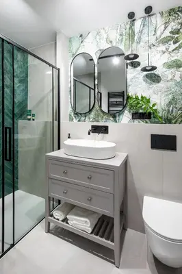 a bathroom with a sink and a mirror at No 7 Terrace in Kraków
