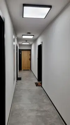 a hallway with white walls and a skylight at No 7 Terrace in Kraków