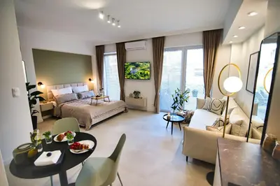 a large living room with a bed and a table at Zator Apartament MINT wanna spa in Zator