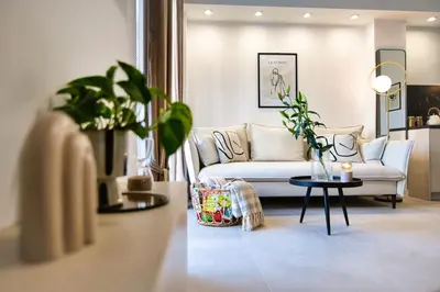 a living room with a couch and a table at Zator Apartament MINT wanna spa in Zator