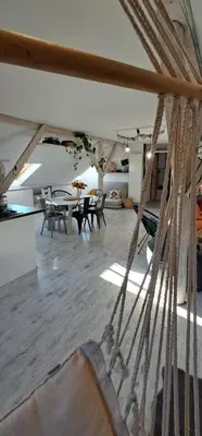 a room with tables and chairs and a hammock at Małopolskie Swojskie in Olszyny