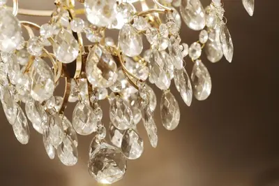 a close up of a chandelier with diamonds on it at Ekskluzywny Apartament w centrum z balkonem i parkingiem in Kraków