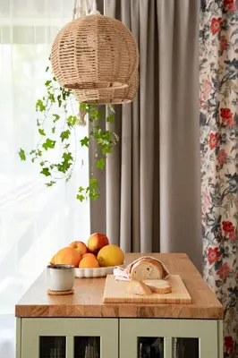 a table with a plate of fruit on a cutting board at Kurka Chata in Nowy Targ