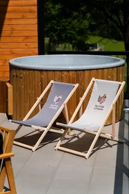 two folding chairs sitting next to a table at Kurka Chata in Nowy Targ