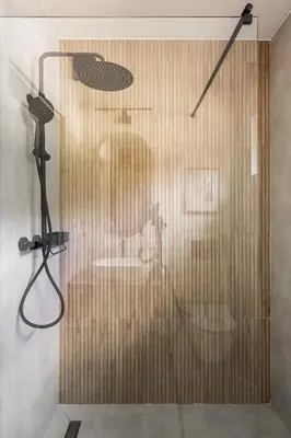 a shower with a glass door in a bathroom at Babia Rest - całoroczny domek z balią z jacuzzi in Zawoja