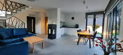 a bedroom with a bed and a desk and a window at Panorama Beskidu in Skrzydlna